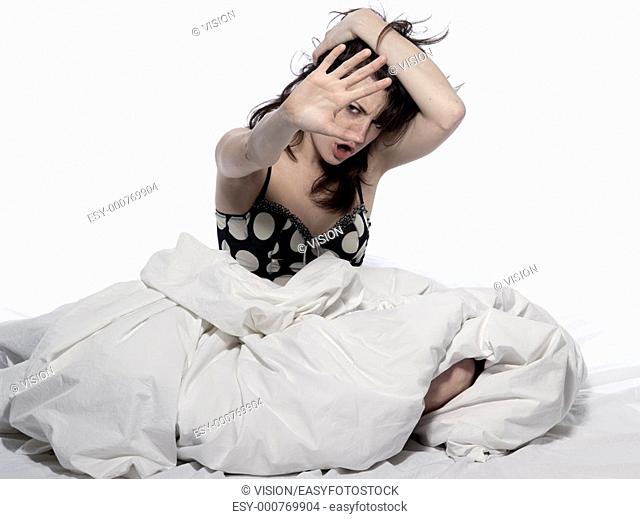 young woman in a white sheet bed on white background