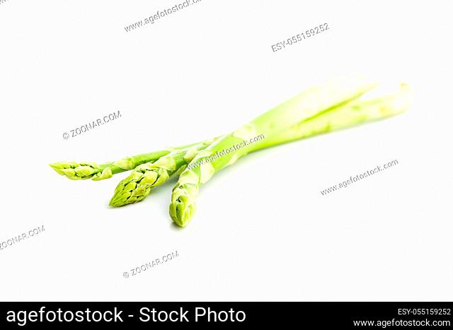Fresh green asparagus. Healthy seasonal vegetable isolated on white background
