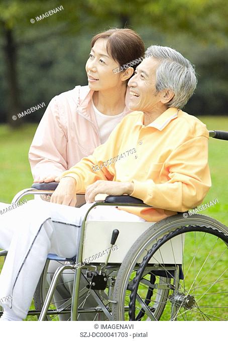 Senior couple with wheel chiar