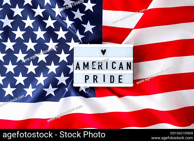 American flag. Lightbox with text AMERICAN PRIDE Flag of the united states of America. July 4th Independence Day. USA patriotism national holiday