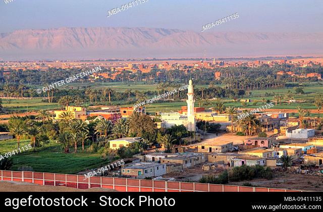 Village with mosque on the western shore with fields and date palms. Suez Canal (Suez Canal), Egypt