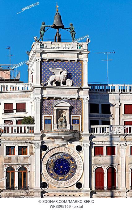 VENICE, ITALY - DECEMBER 19, 2012: Famous St Marks Clock Tower Landmark With Bell on Top and Zodiac Dial in Venice, Italy