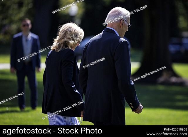 United States President Joe Biden and first lady Dr. Jill Biden walk on the South Lawn of the White House before boarding Marine One in Washington, DC, US