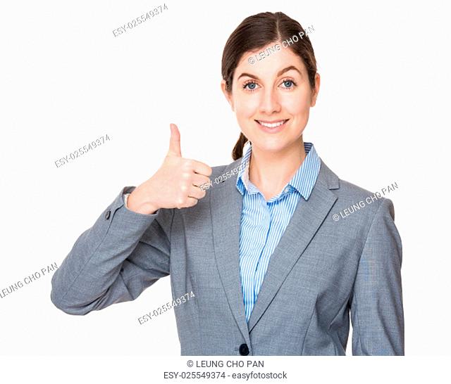 Brunette businesswoman with thumb up gesture