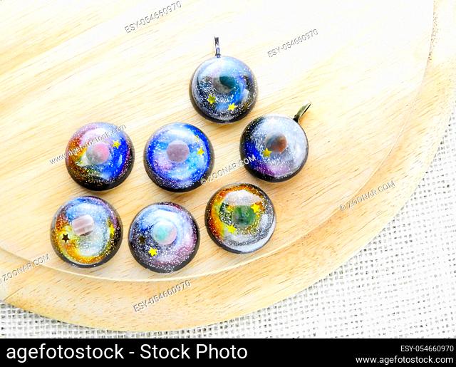 Create galaxy drink coasters using resin, glitter and pigment powders, handmade items. Suitable for keychains, necklace and pendant