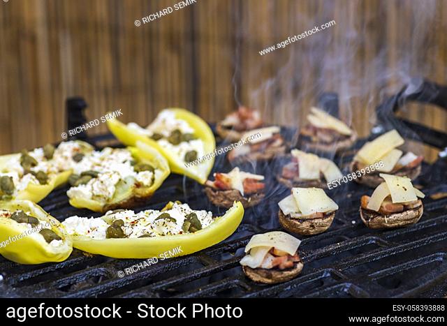grilled peppers with feta cheese and capers and mushrooms with bacon baked with Emmental cheese