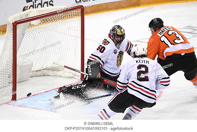 (L-R) Corey Crawford, Duncan Keith of Chicago and Kevin Heyes of Philadelphia in action during the NHL Global Series match Philadelphia Flyers vs Chicago...