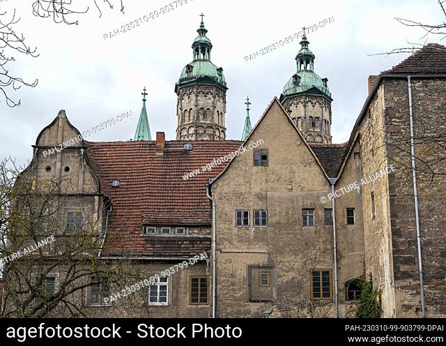 10 March 2023, Saxony-Anhalt, Naumburg: The towers of the cathedral in Naumburg rise up behind the former bishop's curia