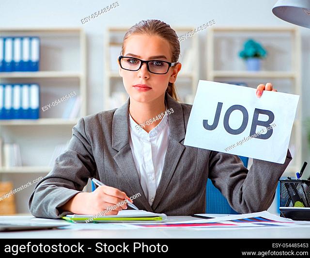 The businesswoman sitting in office with message