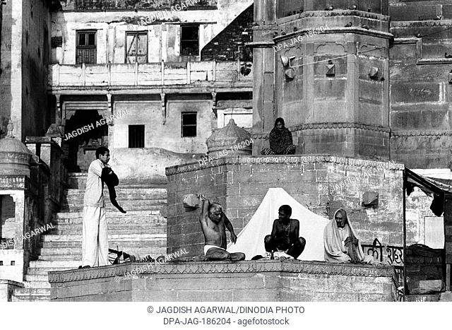 Sadhus praying on Ghats of river Ganges Varanasi Uttar Pradesh India Asia 1982