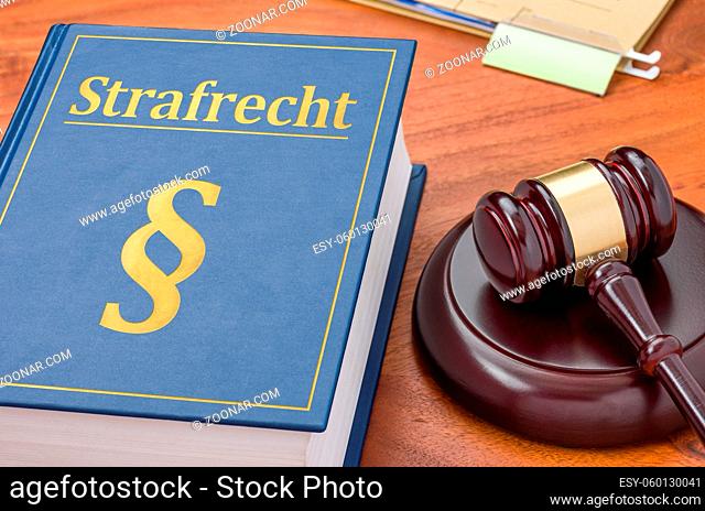 A law book with a gavel - German Translation of Criminal law - Strafrecht