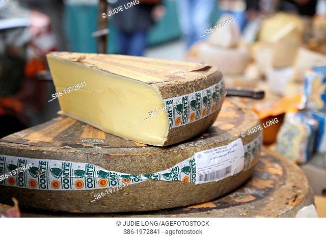 Freshly Made Comte Cheese Offered for Sale in Parisian Food Market
