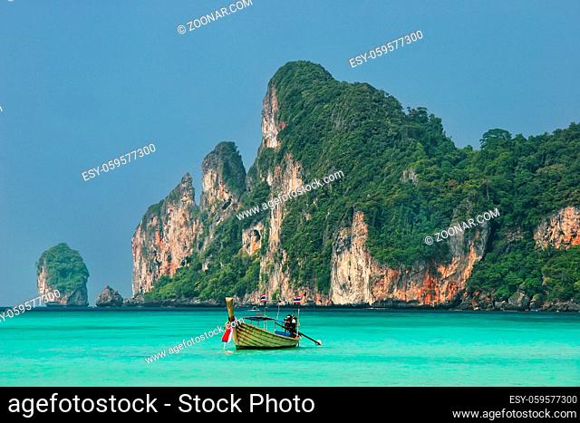 Longtail boat anchored at Ao Loh Dalum on Phi Phi Don Island, Krabi Province, Thailand. Koh Phi Phi Don is part of a marine national park