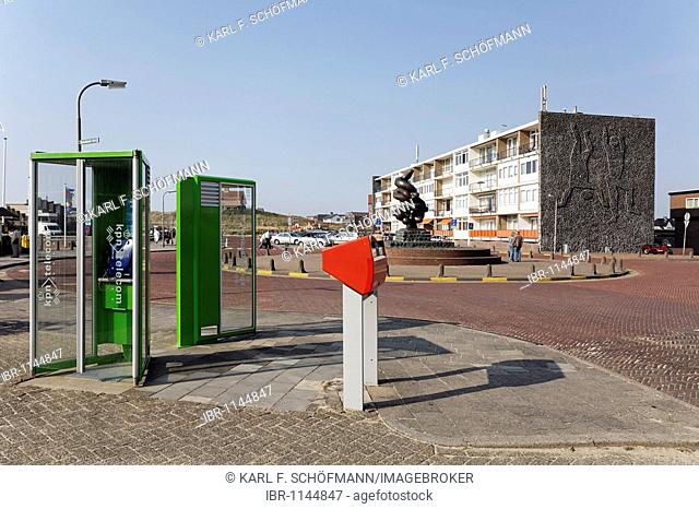 Square with phones, mailbox and apartment building, a typical seaside resort on the Dutch North Sea coast, Bergen aan Zee, Holland, Netherlands, Europe