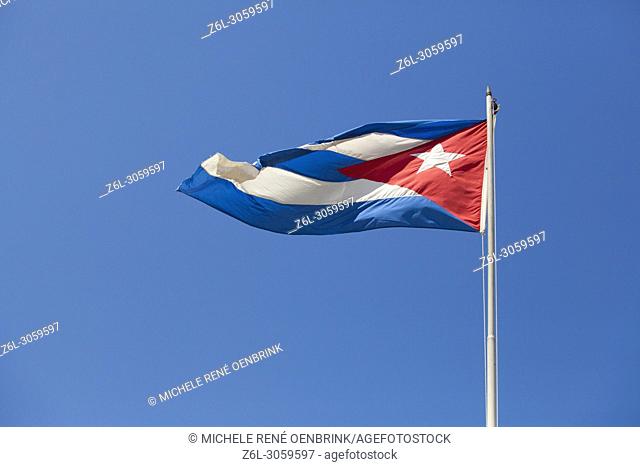 Cuban flag blowing in the breeze in Old Havana Cuba