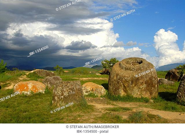 Archeology, ancient large stone jars in the landscape, Jar Site 1, Thong Hai Hin, Plain of Jars, near Phonsavan, Xieng Khouang province, Laos, Southeast Asia