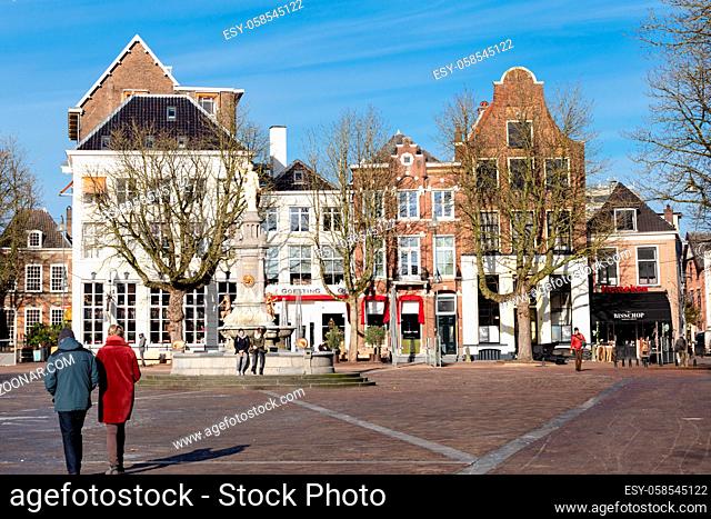 Deventer, Netherlands - January 31, 2021: Scenic view of central market downtown with historic Wilhelmina fountain in city Deventer in Overijssel, Netherlands