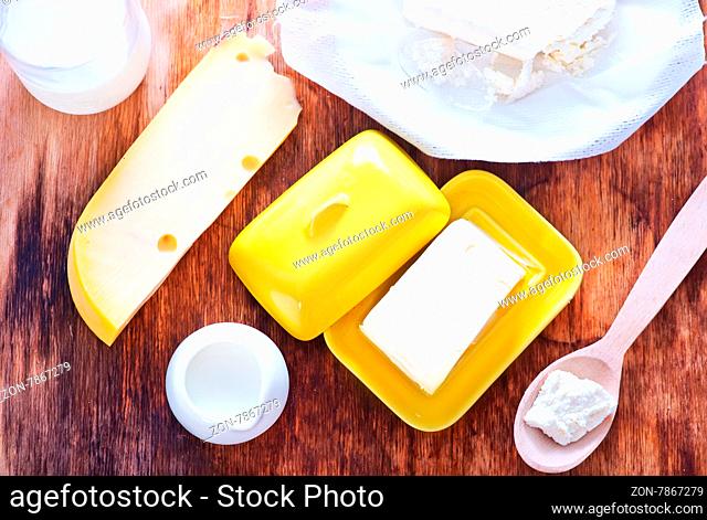 milk products on the wooden table, cottage and butter