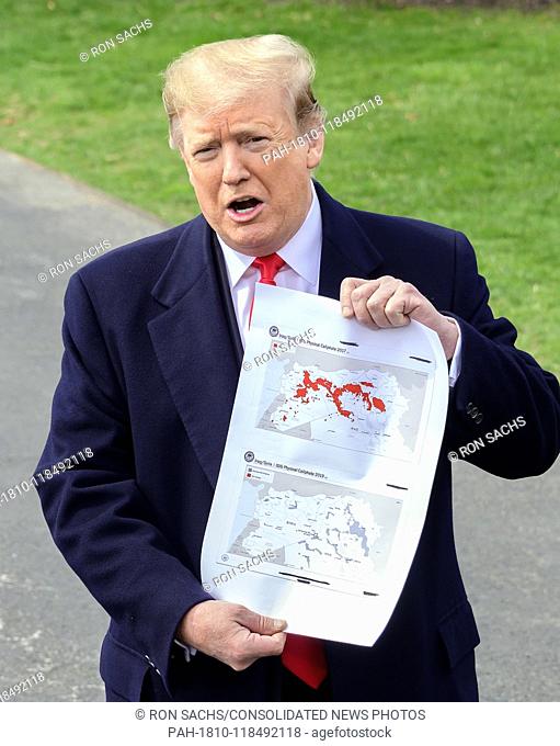 United States President Donald J. Trump shows a map showing the territory of the ""Iraq/Syria ISIS Physical Caliphate 2017"" (top) ""Iraq/Syria ISIS Physical...