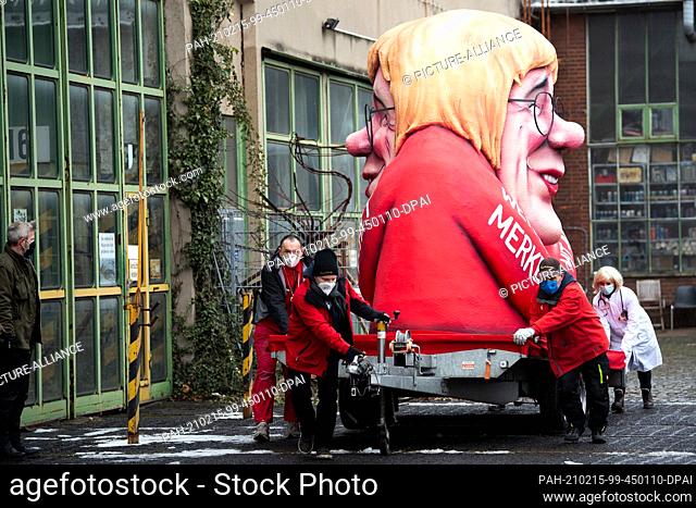 15 February 2021, North Rhine-Westphalia, Duesseldorf: A motto float on which a figure is supposed to represent a cross between Armin Laschet (CDU)