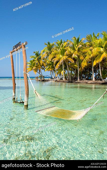 Swing and hammock in water at North Long Coco Plum Caye, Belize