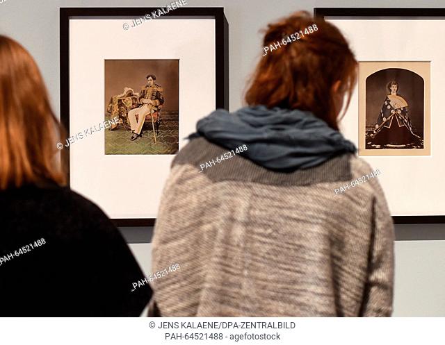 Two visitors look at the exhibition 'Pale Pink and Light Blue. Japanese Photography from the Meiji Period (1868-1912)' in the Berlin Museum for Photography in...