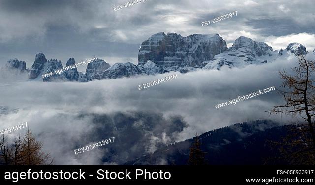 Snow-capped mountains in clouds panorama landscape in alps, Adamello Brenta, Italy