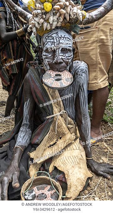 Mursi Tribe headdress woman selling lip plates Omo Valley Ethiopia