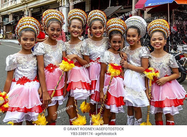 A Group Of Filipino Elementary Schoolchildren Pose For A Photo During The Tambor Trumpa Martsa Musika (Drum & Bugle Corps) Contest, Dinagyang Festival, Iloilo