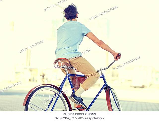 hipster man riding fixed gear bike