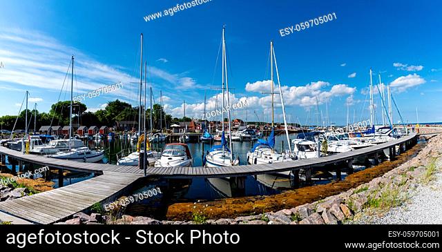 Lundeborg, Denmark - 9 June, 2021: the marina and harbor of Lundeborg in southern Denmark with many sailboats moored at the docks