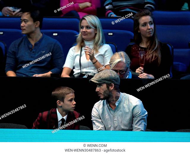 David Beckham and son Romeo watch the men's singles match between Milos Raonic of Canada and Dominic Thiem of Austria on day five of the ATP World Tour Finals...
