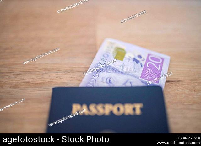 Picture of a Twenty Swedish Kronor Banknote Inside a blurry United States of America Passport