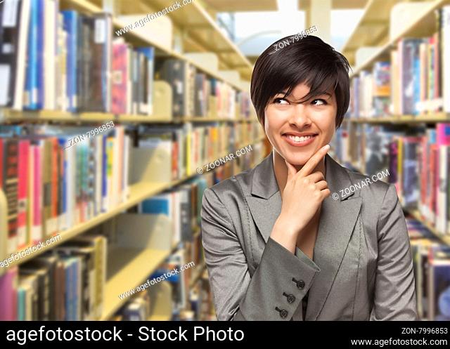 Curious Mixed Race Girl Looking to the Side in the Library