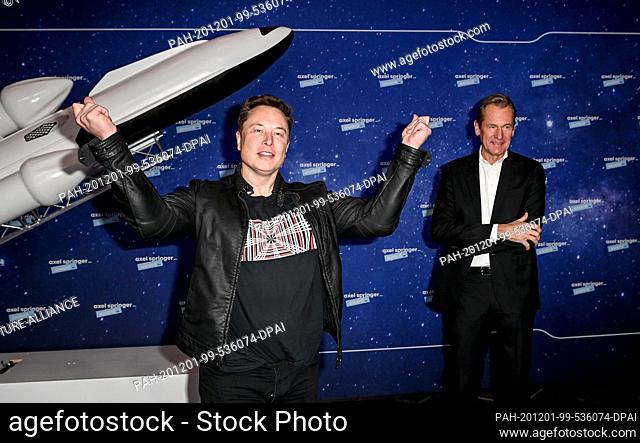 01 December 2020, Berlin: Elon Musk (l), head of the space company SpaceX and Tesla CEO, and Mathias Döpfner, CEO of Axel Springer SE