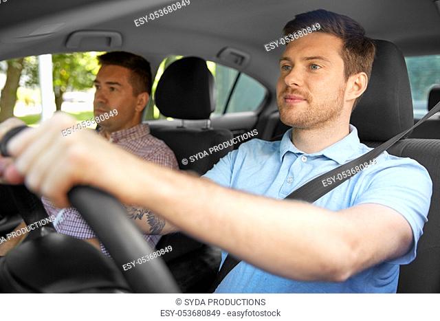 car driving school instructor and male driver