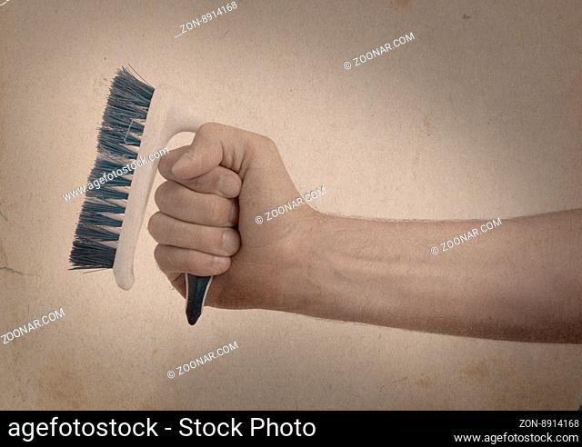 Cleaning brush in hand isolated on white - Vintage