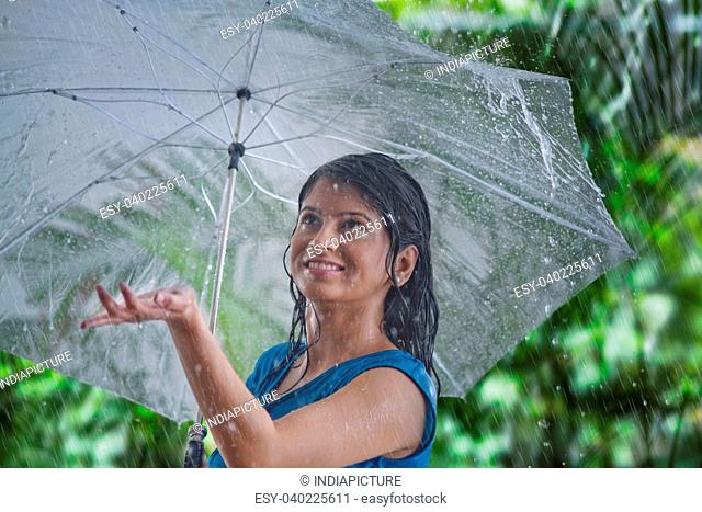 Woman enjoying the rain