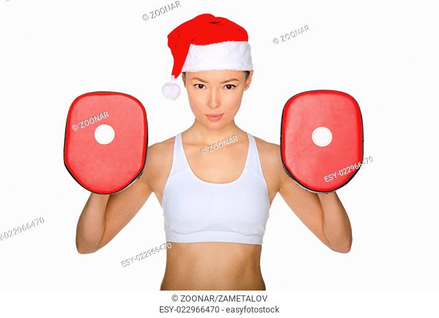 Woman protects herself in Santa Claus hat