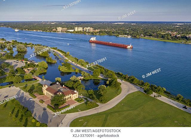 Detroit, Michigan - A bulk cargo carrier in the Detroit River passes Belle Isle State Park