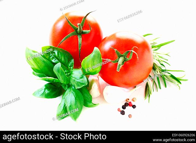 Tomatoes With Herbs And Spices Isolated On White