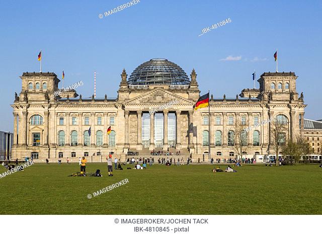 German flag flying next to the Reichstag building, government quarter, Berlin, Germany, Europe