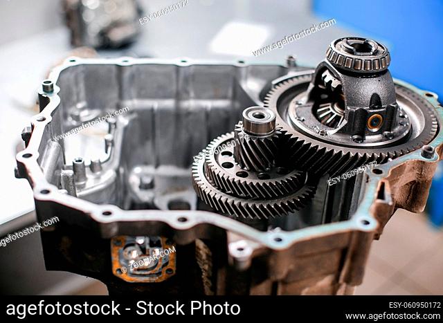 Cross-section of a car gearbox. mechanics work in the garage