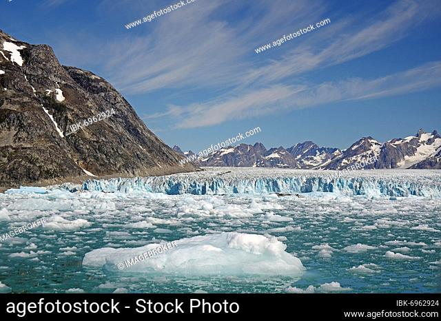 Pieces of ice in front of glacier, barren mountains, Knud Rasmussen Glacier, Tasilaq, Greenland, Denmark, North America
