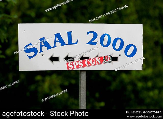 11 July 2021, North Rhine-Westphalia, Bergisch Gladbach: A sign reading ""Saal 2000"" stands in front of the area where a banned meeting was to take place