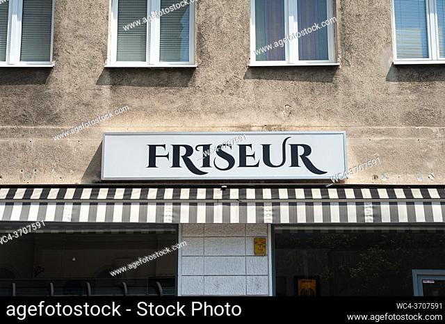 Vienna, Austria, Europe - Exterior view of a building with a hairdresser sign in the Viennese city centre