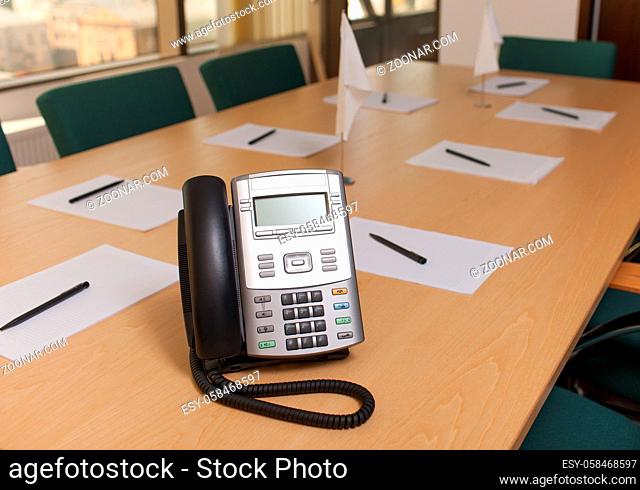 Officce phone on table in meeting room