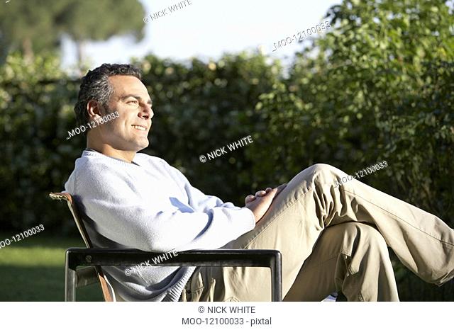 Man Relaxing in Garden