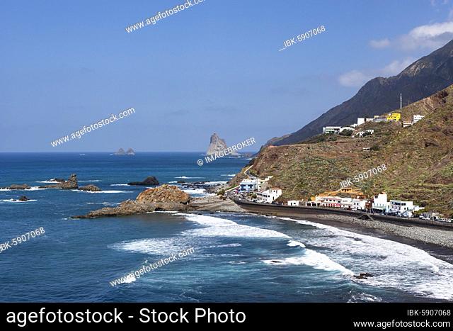 Coastal road with cliffs in the Anaga Mountains with beach section Playa de Roque de las Bodegas near the township of Taganana, Almáciga, Tenerife
