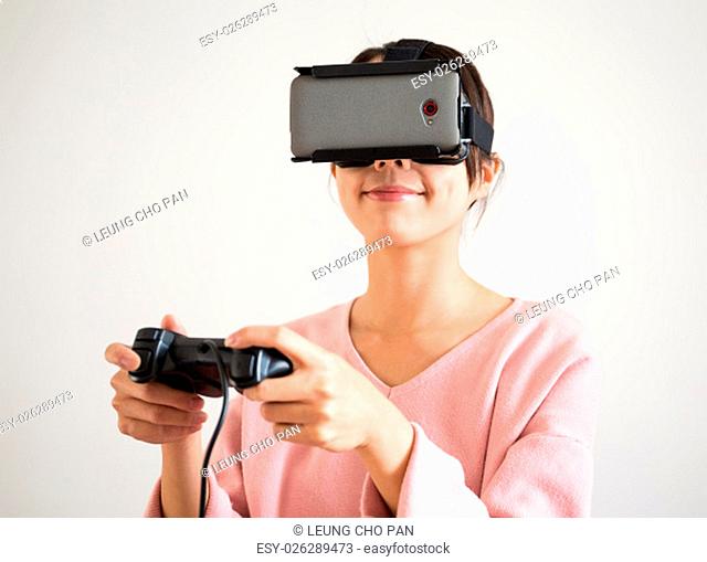 Woman play with vr device and joystick